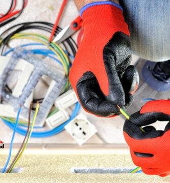 Swiss self-employed electrician working with cables – symbol of precision, reliability, and professionalism, with Switzerland Web logo
