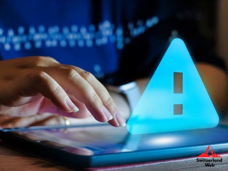 Hand tippt auf Tablet mit Warnsymbol – häufige Fehler beim Erstellen einer Website, Symbolbild für Webdesign Schweiz.